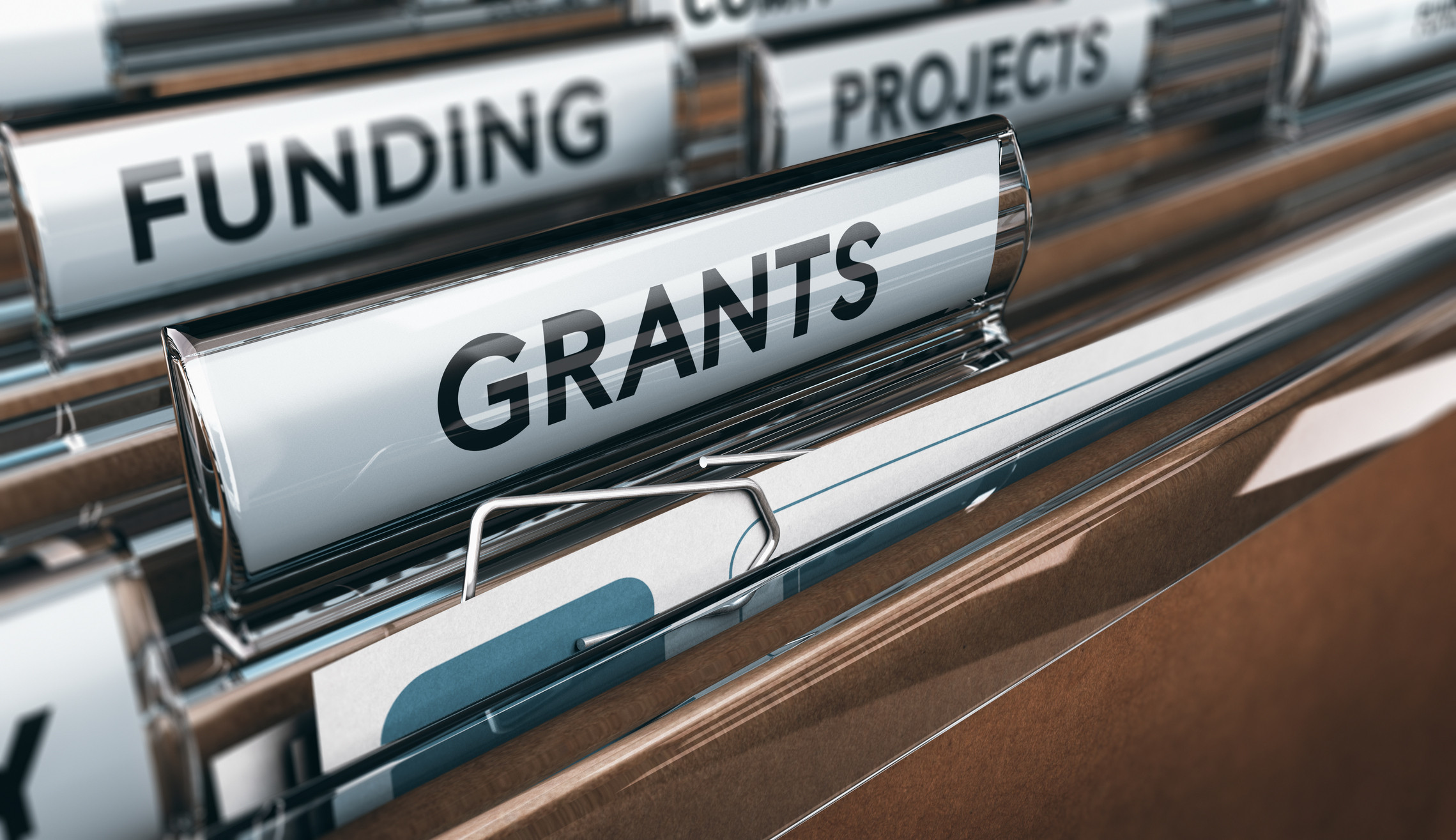 File folders labeled Grants, Funding, and Projects, representing government-funded opportunities for technology research and development in New Orleans and beyond.
