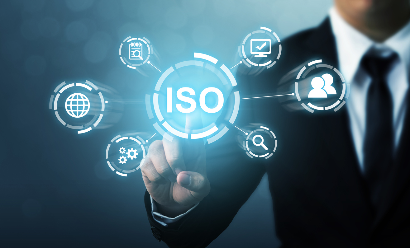 A businessman navigating ISO standards, demonstrating the benefits of ISO 9001 certification program to promote company culture.