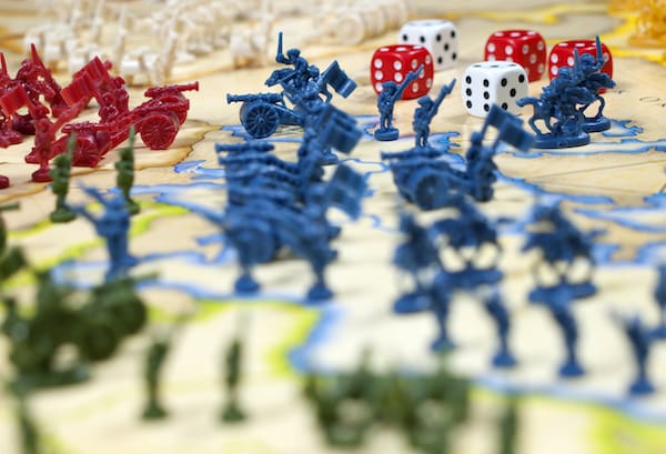 The question "How do wargames work?" represented by soldiers and dice on a map
